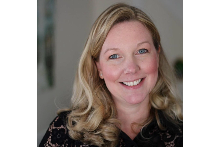 Headshot of blond woman smiling